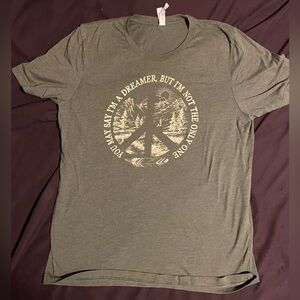 Women’s size large “Imagine” tee shirt, never worn.